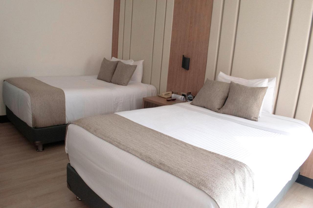 Hotel Dann Carlton Belfort Medellín Esterno foto A room at the hotel
